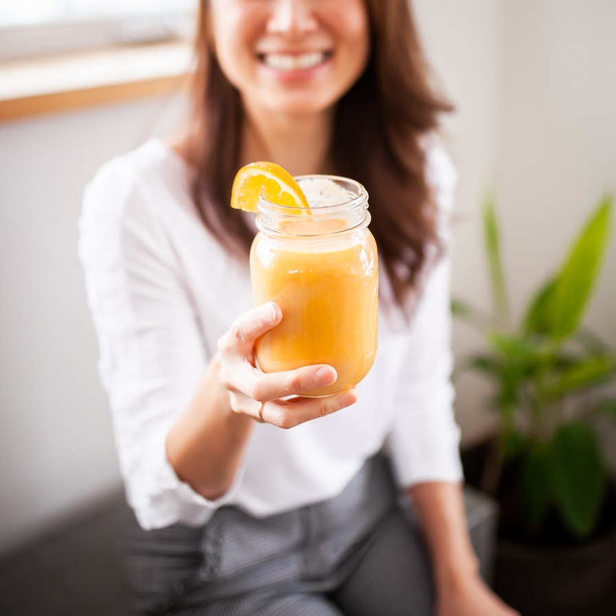 A Woman Holding A Healthy Smoothie